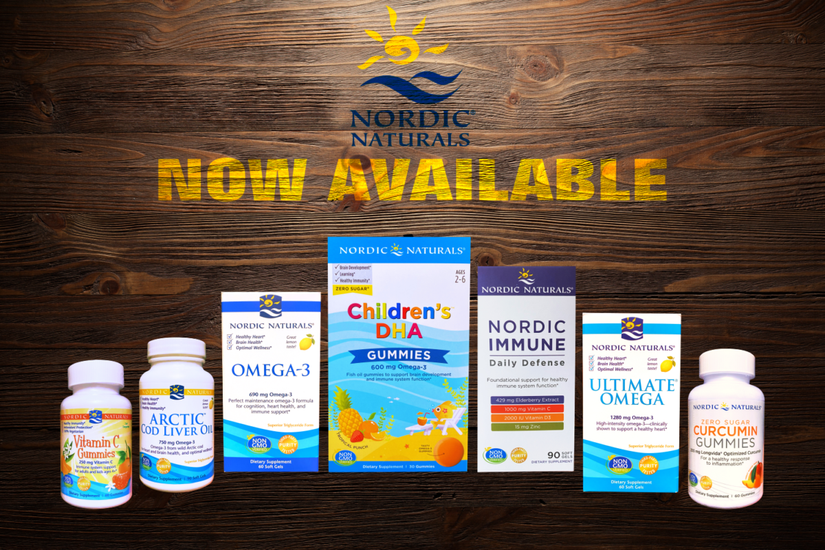 nordic naturals products overtop a dark wood background